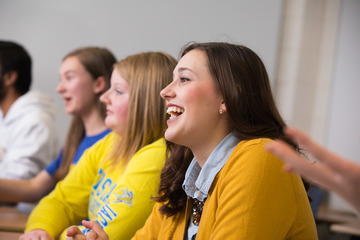 Student laughs with her classmates