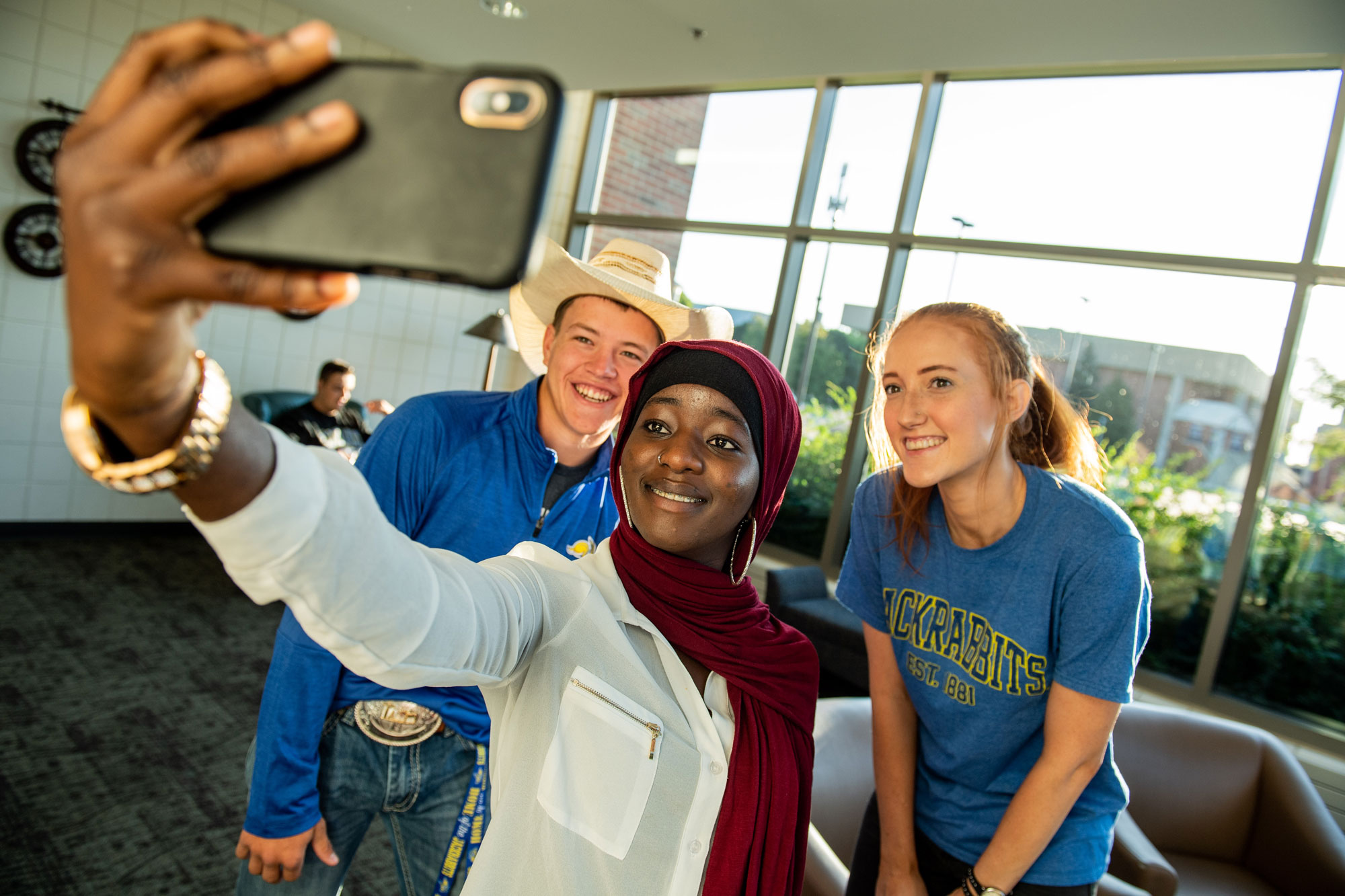 Three students taking a selfie in the student union