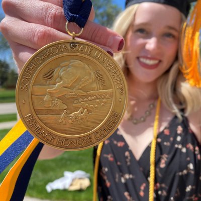 Hanna Smith poses with medallion 