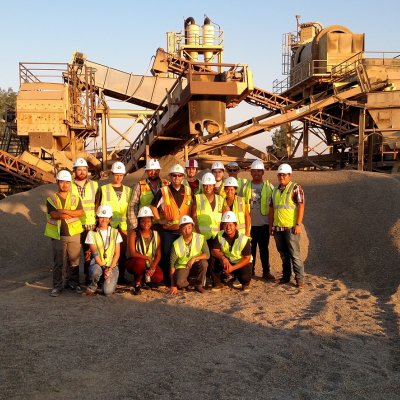 Students standing at a project.