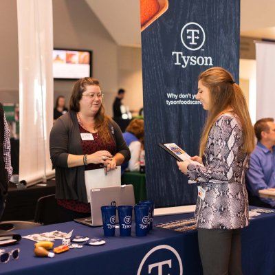 CAFES student talking to Tyson representative 