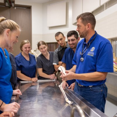 Instructor showing bone to students