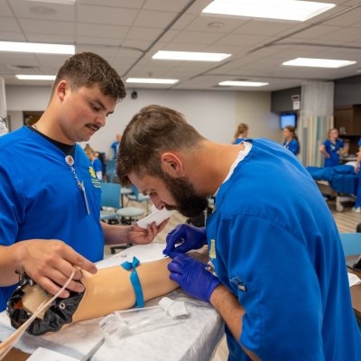 Nursing students working in a skills lab.