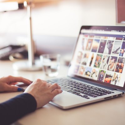 View of a laptop with various photo images on the screen.