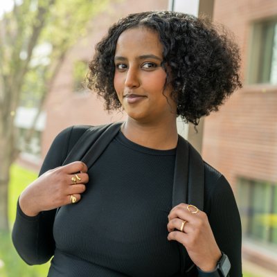 Photo of young woman smiling at the camera.