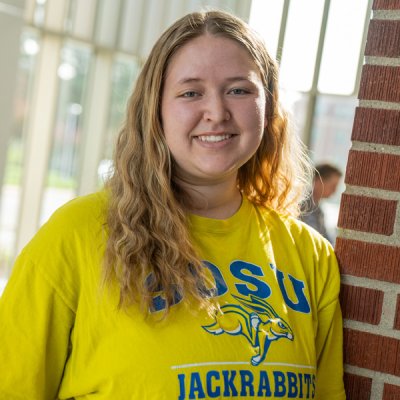 College student smiling at camera.