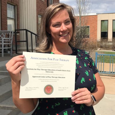 Staci with Play Therapy certificate 