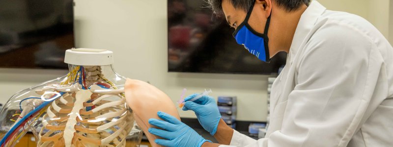 Student administers a vaccine