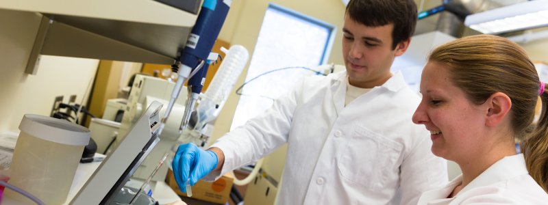 Two students in the Pharmacy lab