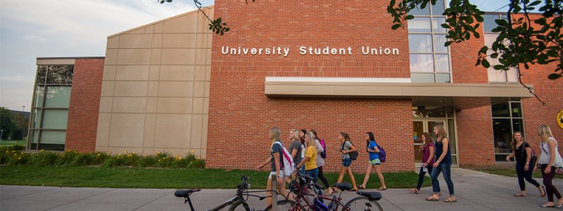 students walk by the University Student Union