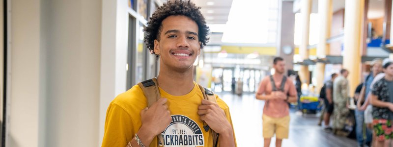 Student standing on mainstreet at the Student Union