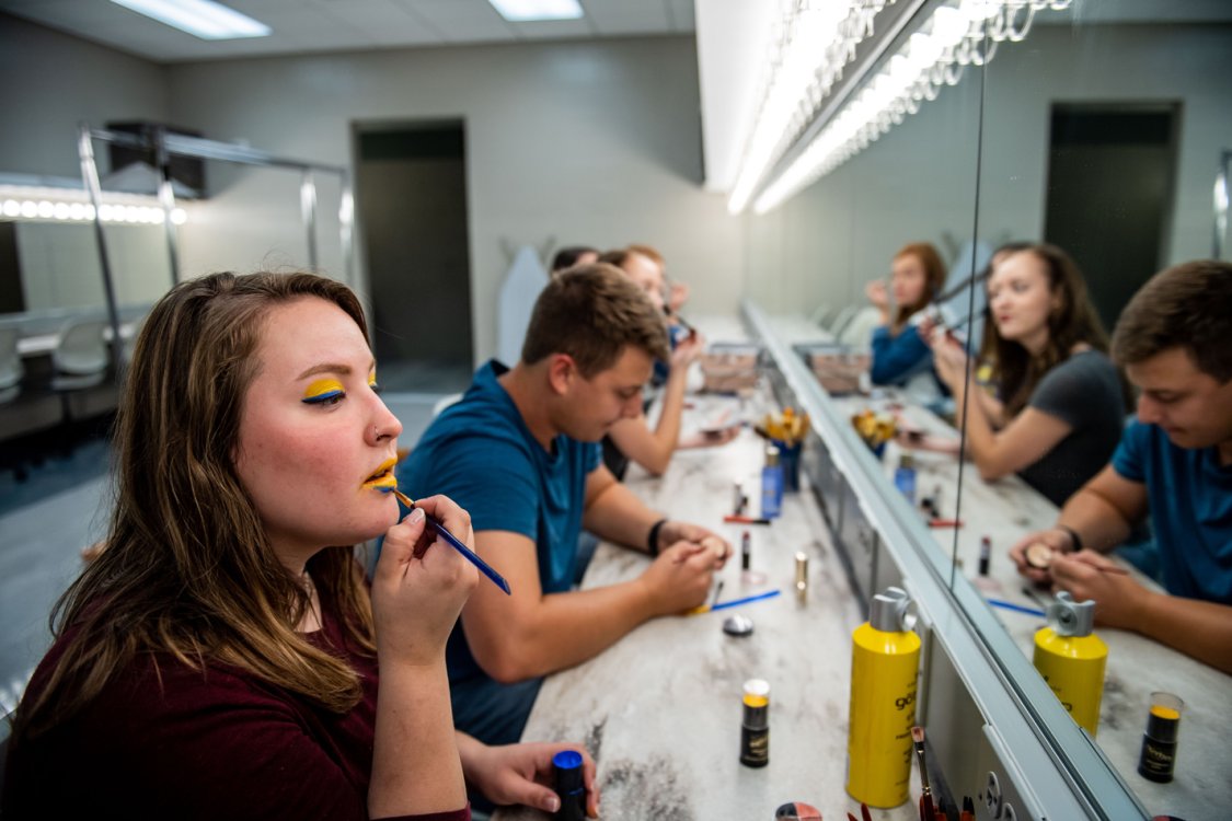 Putting on makeup before the show.