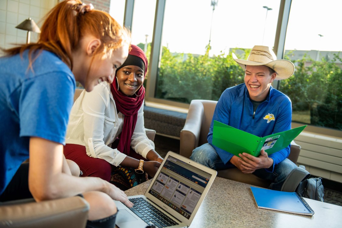 Three students hanging out in the Union