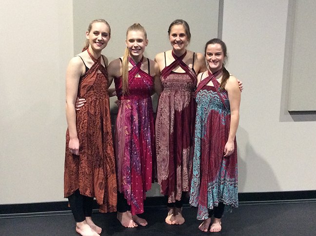 Dancers in costume before a performance.