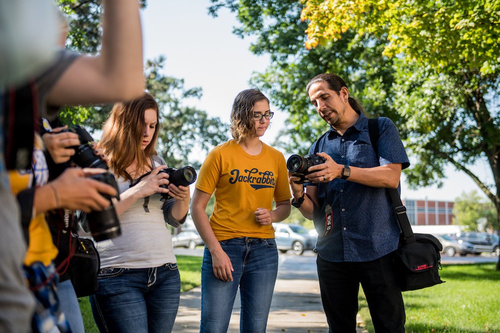 Communication students practicing photography