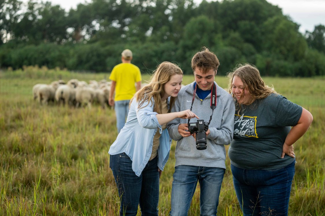 Students looking at a camera