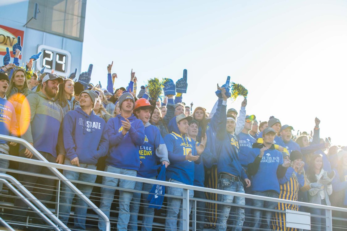 Group of students cheering at a game.