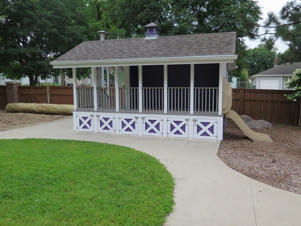 The mini train depot with slide structure in the playground. 