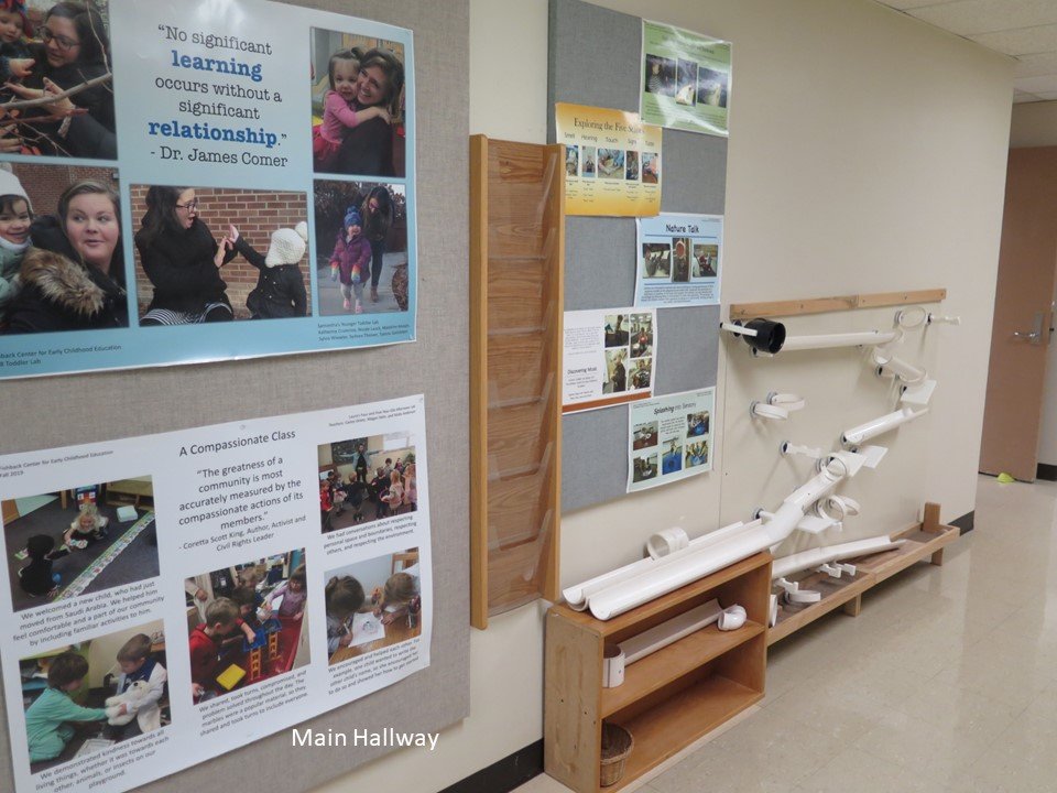 In the hallway of the program there is a magnetic tubing wall hanging system for children to manipulate.