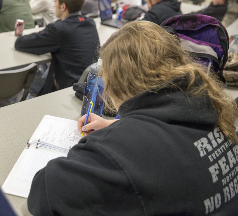 Student taking notes