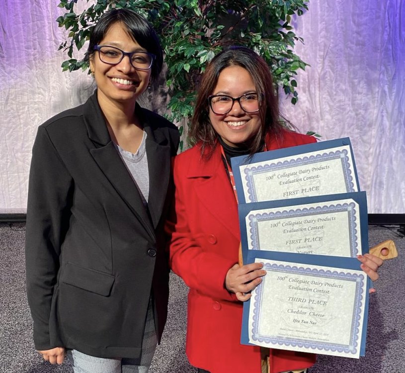 Dr Maneesha Mohan and Ifra Tun Nur holding three certificates from dairy product judging competition.