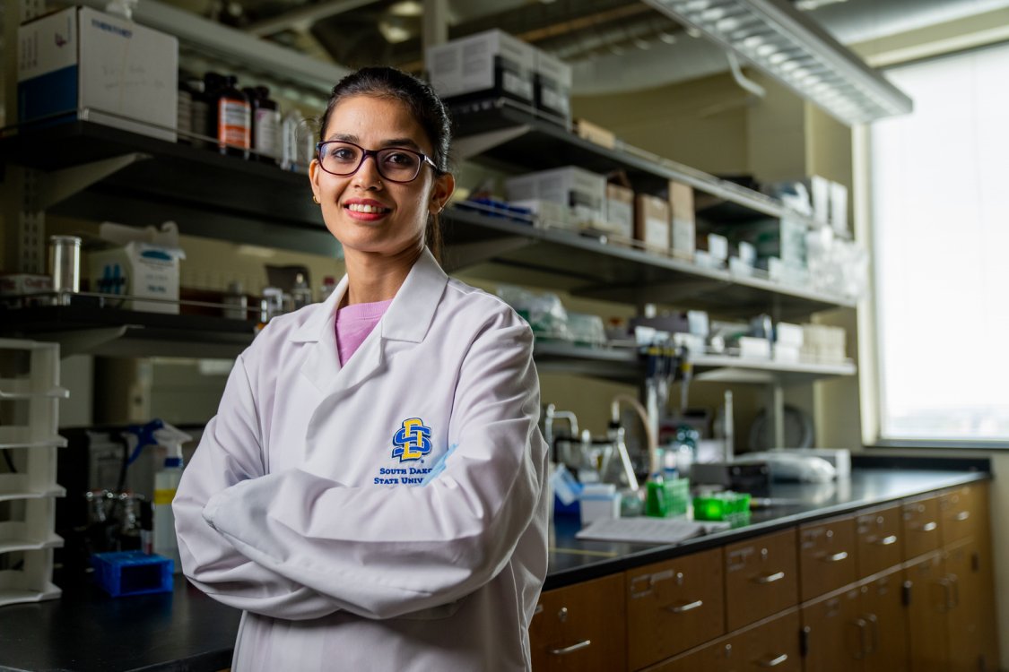 College of Natural Sciences Student in a lab.