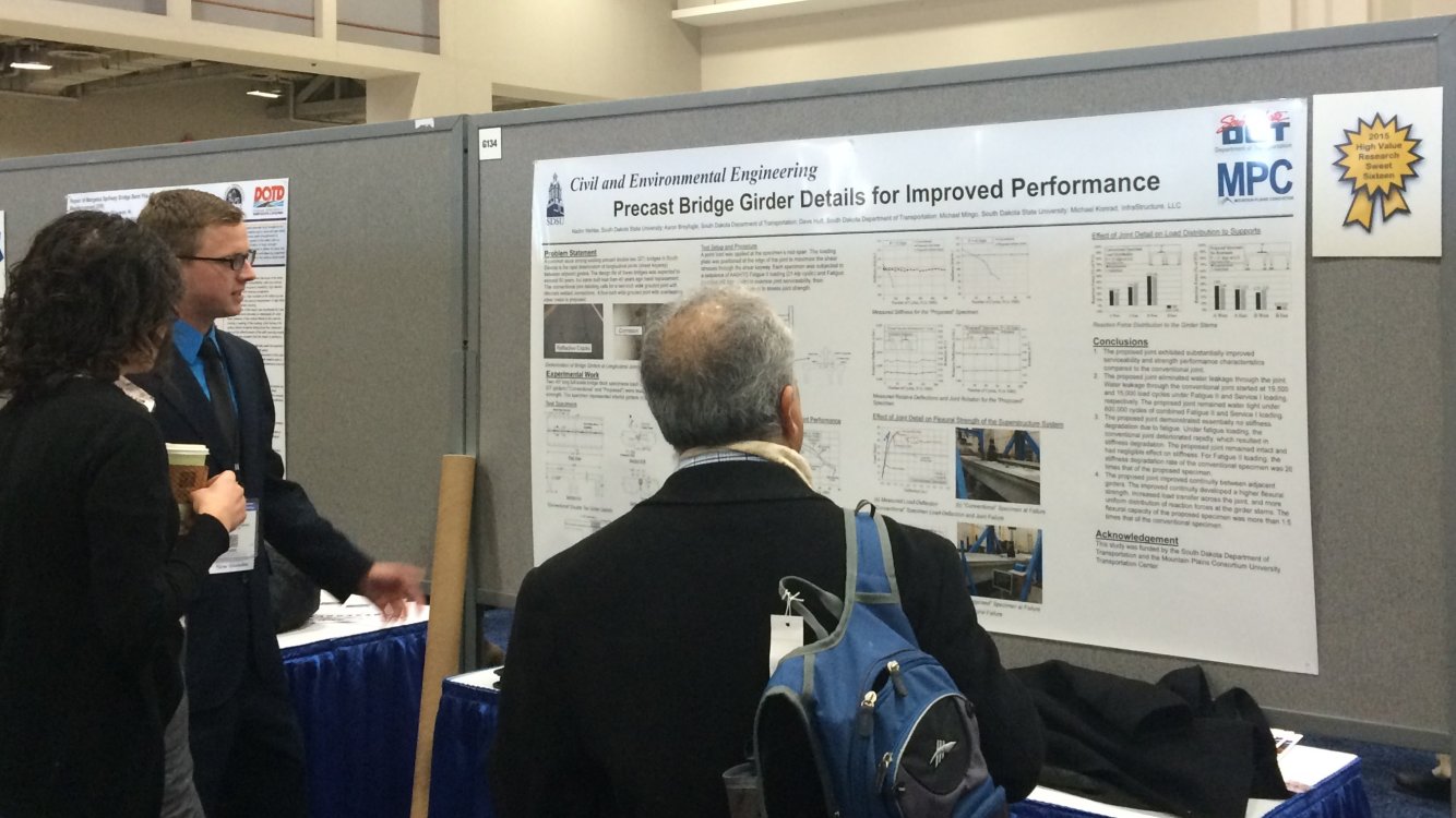 Researchers reviewing informatoin on precast bridge girder details for improved performance.