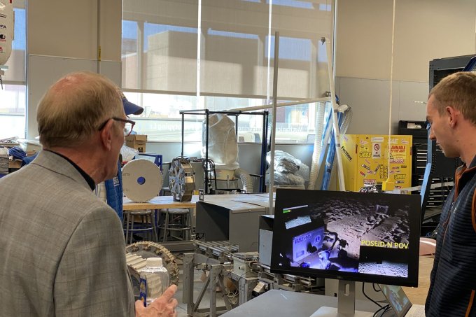 Liam Murray, a graduate student in mechanical engineering, right, shows footage taken on Cocoa Beach, Florida, of the rover prototype that he and fellow students built for NASA’s RASC-AL competition in June. The team finished third overall and, as in 2023, received the award for building the best prototype in the Revolutionary Aerospace Systems Concepts – Academic Linkage (RASC-AL) competition.