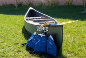 A canoe packages including two oars and two lifejackets. 