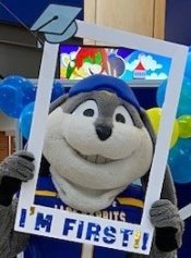 Jack the Rabbit holding a picture frame that says "I'm First!"